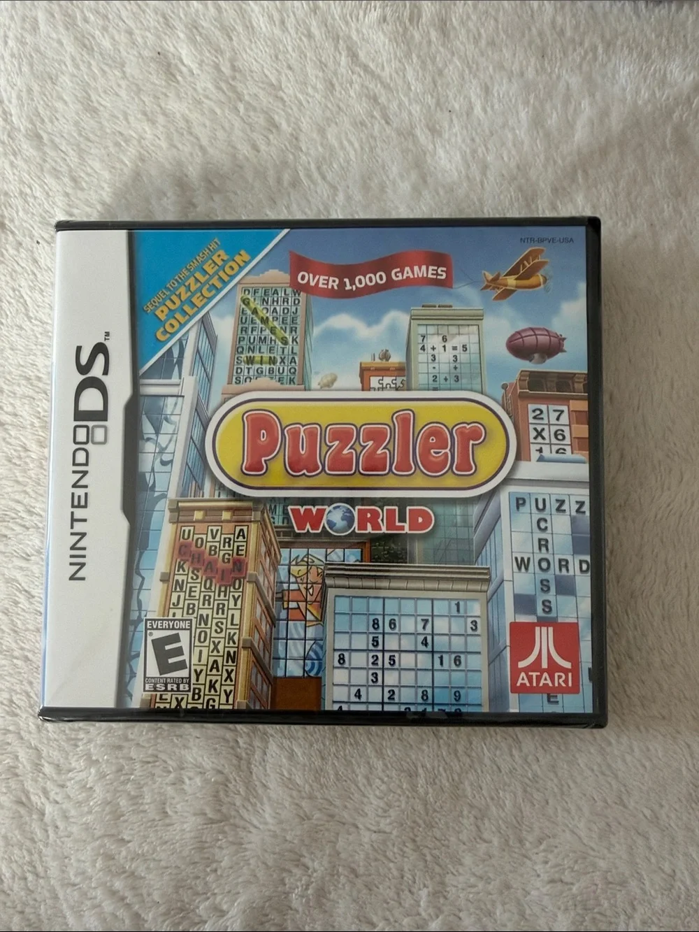 Nintendo DS Puzzler World Case with Red, Blue, Yellow Artwork